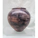 A studio pottery vase in pinks and greys, indistinctly signed,