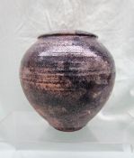 A studio pottery vase in pinks and greys, indistinctly signed,