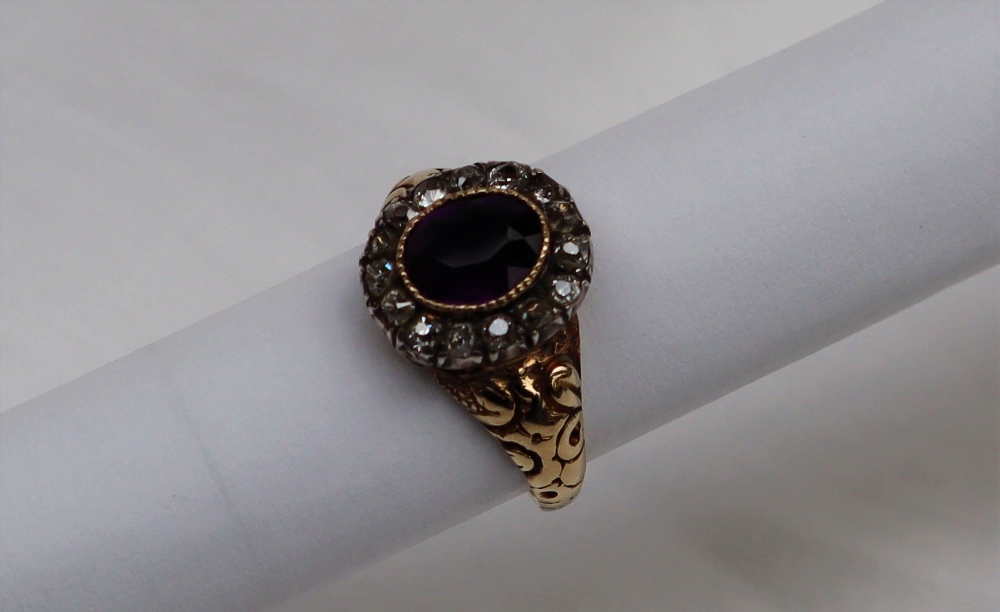 A Victorian amethyst and diamond cluster ring with a central oval faceted amethyst surrounded by - Image 2 of 5