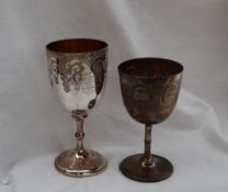 A Victorian silver goblet, decorated with scrolling leaves on a ring turned stem and spreading foot,