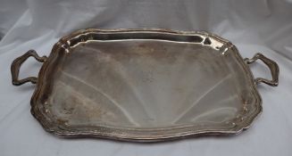 A Camusso Peruvian sterling silver twin handled tray, with a raised line rim,