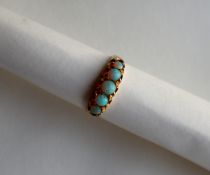 A 15ct yellow gold five stone opal ring, size T,