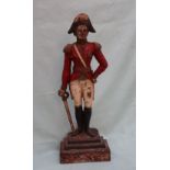 A cast iron door stop in the form of Wellington, in military uniform, leaning on his sword,