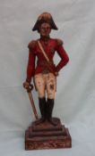 A cast iron door stop in the form of Wellington, in military uniform, leaning on his sword,