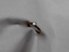 A solitaire diamond ring, the round brilliant cut diamond approximately 0.