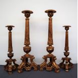 A pair of gilt decorated torcheres,