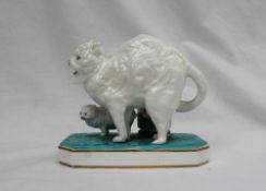 A Continental porcelain table top match dispenser modelled as a cat and kitten,