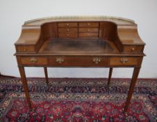 An Edwardian mahogany Carlton house type desk in the Georgian taste decorated with satinwood cross