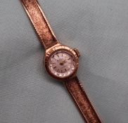 A Lady's 9ct yellow gold wristwatch, the circular silvered dial with batons, inscribed Bentima Star,