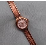 A Lady's 9ct yellow gold wristwatch, the circular silvered dial with batons, inscribed Bentima Star,