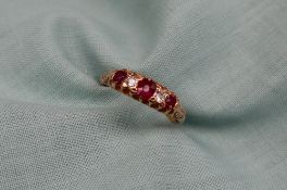 A ruby and diamond line ring,