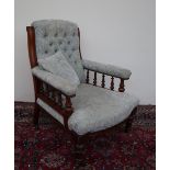 A Victorian mahogany library chair, with a button back scroll over back,