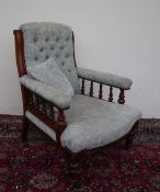 A Victorian mahogany library chair, with a button back scroll over back,