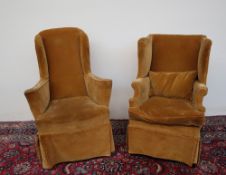 A matched pair of 19th century wing armchairs in the Georgian taste,