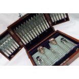 A late Victorian electroplated and mother of pearl fruit set, comprising twelve knives and forks,
