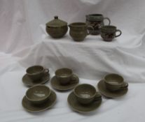 A Harry Davies for Crowan pottery part tea set comprising four tea cups, a tea bowl, five saucers,