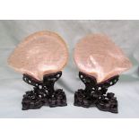 A pair of Chinese carved mother of pearl shells, finely relief decorated with pagodas,