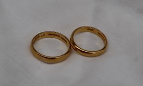 Two 22ct yellow gold wedding bands, size P and L 1/2,