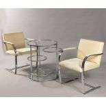 TWO BRNO CHAIRS AND A TABLE 1980s Chrome-plated steel, leather and glass 2 chairs: 80 x 58 x 53