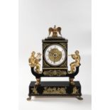 AN EMPIRE CLOCK WITH MUSIC BOX 1830s Wood, brass, glass, blackened and gilded 60 x 47 x 17,5 cm