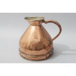 A 19th CENTURY ENGLISH COPPER TWO GALLON MEASURING JUG, with a shaped riveted handle and rolled