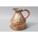 A 19th CENTURY ENGLISH COPPER TWO GALLON MEASURING JUG, with a riveted shaped handle, 31cm (