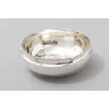 A .800 STD CONTINENTAL SILVER BOWL, the rim with applied beaded border, plain well standing on a