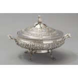 A .833 STD PORTUGUESE SILVER TUREEN, the removable lid with a floral finial, gadrooned border and