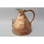 A MASSIVE EARLY 19th CENTURY ENGLISH FIVE GALLON COPPER AND BRASS FITTED MEASURING JUG, with a