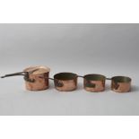 A SET OF FOUR 19th CENTURY COPPER SAUCE PANS, of various sizes, each with a hand forged steel