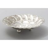 A .900 STD CONTINENTAL SILVER BOWL, a wavy gardrooned rim, the border embossed with scrolls,