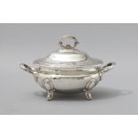 A SILVERPLATE TUREEN OF OVAL FORM, removable cover with detachable handle, the bowl with fold-over