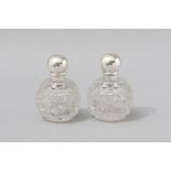 A PAIR OF VICTORIAN SILVER AND HOBNAIL-CUT PERFUME BOTTLES, LONDON 1892, S.MORDAN & Co., the screw