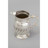 A GEORGE III SILVER CREAMER, LONDON 1818, MAKER'S MARKS INDECIPHERABLE, fold-over rim with reeded