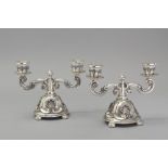 A PAIR OF .833 STD PORTUGUESE SILVER TWO-ARM CANDELABRA, the entire piece embossed with shells,