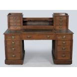 AN EDWARDIAN MAHOGANY PEDESTAL DESK, the upper section with twin banks of small drawers and a