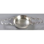 A GEORGE III SILVER LEMON STRAINER, LONDON, CIRCA 1758 - 1776, with gadrooned rim, pierced bowl,