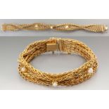 AN 18ct YELLOW GOLD AND PEARL BRACELET, woven band with three claw-set pearls, tongue and groove
