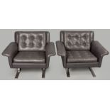 A PAIR OF GREY LEATHER ARMCHAIRS, DESIGNED BY AIRFLEX, the deep buttoned squab and seat housed in