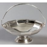 A GEORGE VI SILVER BASKET, BIRMINGHAM 1937, WILLIAM SUDDLING LTD., with swing-over handle, the