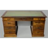 A COMTEMPORARY HARDWOOD PEDESTAL DESK, the moulded top inlaid with a green leather writing surface