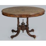 A VICTORIAN WALNUT AND BURR OVAL TABLE, the quartered top with a beaded frieze standing on four