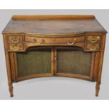 AN EDWARDIAN MAHOGANY AND INLAID BUFFET, the bowed top with an oval inlay and stringing above a