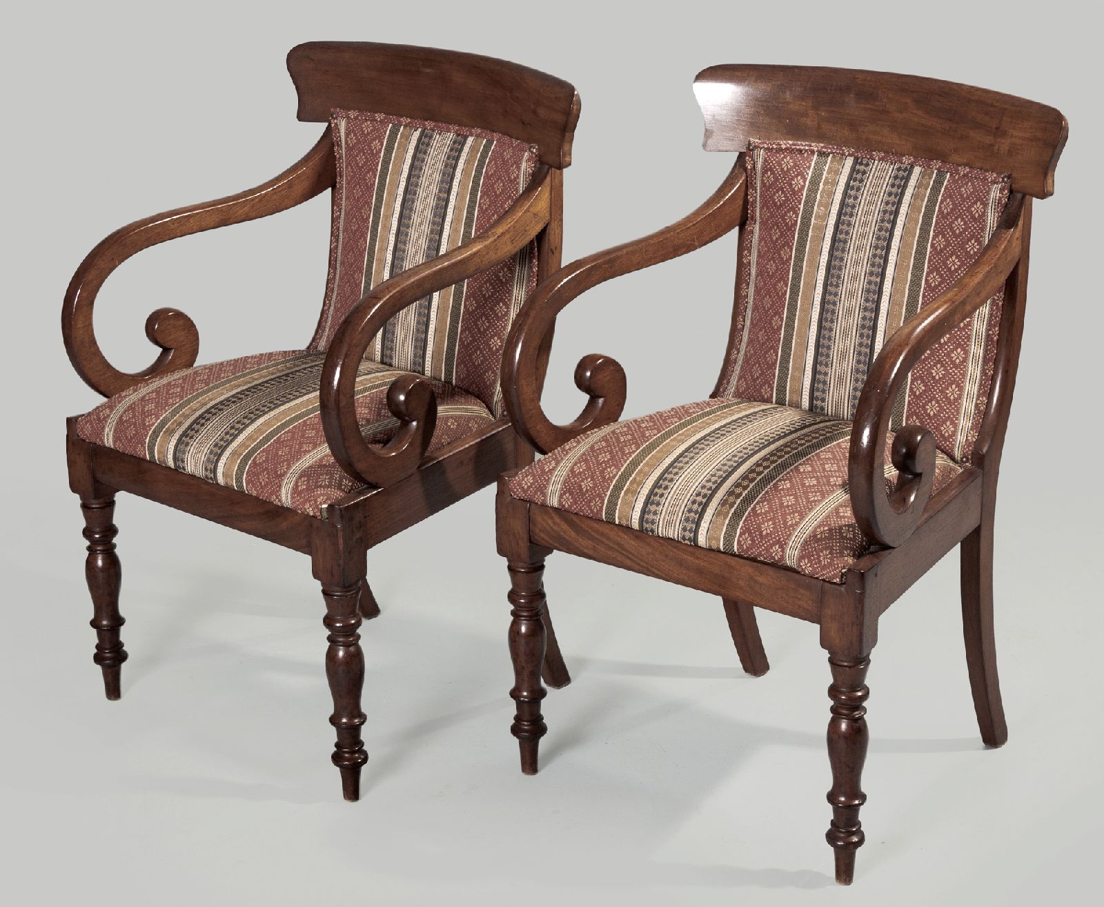 A PAIR OF EARLY VICTORIAN MAHOGANY ARMCHAIRS, the curved top-rails above upholstered backs and