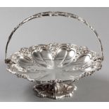 A SILVERPLATE BASKET, the swing-over handle decorated with embossed scrolls, fruit and applied