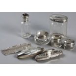 AN ASSEMBLED EIGHT PIECE SILVER DRESSING TABLE SET, VARIOUS DATES AND MAKERS, composed of two nail