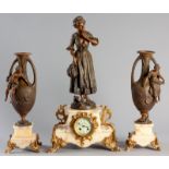 AN EARLY 20th CENTURY SPELTER CLOCK GARNITURE, the mechanism with a painted porcelain dial and blued