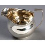 A GEORGE III SILVER CREAMER, LONDON 1808, WILLIAM BURWASH, fold-over rim, with attached reeded C-