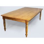 A CAPE YELLOWWOOD (PROBABLY) AND BASSWOOD DINING TABLE, the moulded top above a plain frieze,