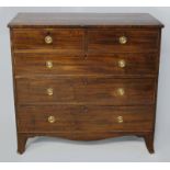 A GEORGE III MAHOGANY CHEST OF DRAWERS, the rectangular top above two short and three long